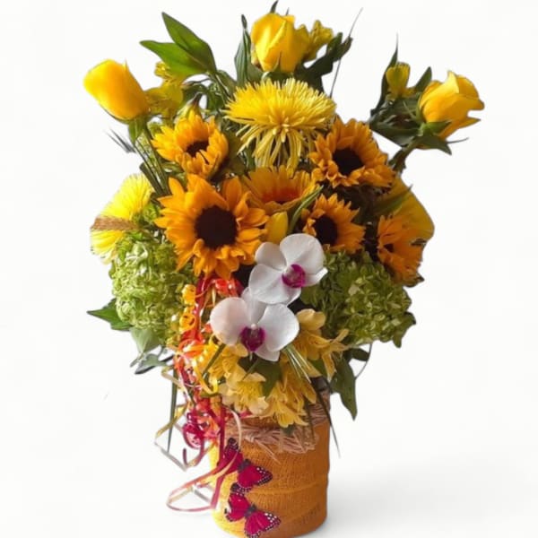 Tall yellow sunflower and rose arrangement with white orchids in a wrapped vase with ribbons and butterflies