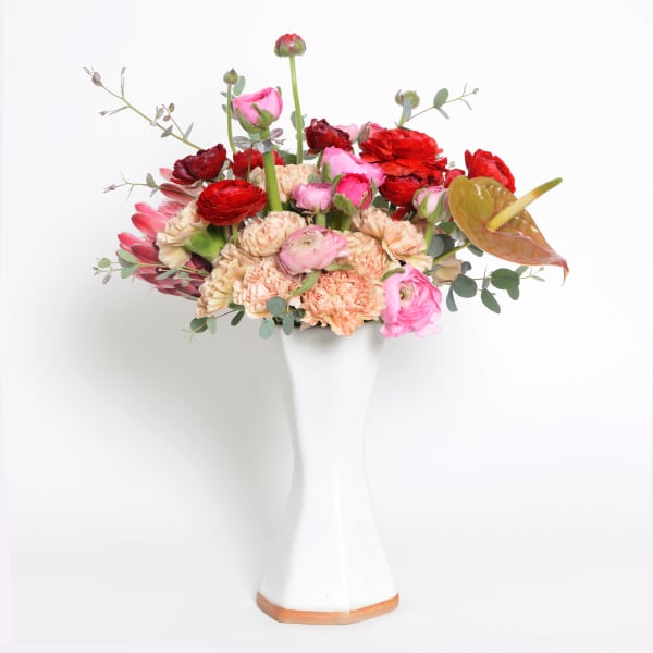 White Inverted Hexagon Vase With Pink and Red Arrangement