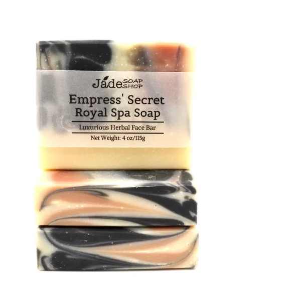 Stack of two marbled cream, black, and peach bar soaps wrapped with an Empress' Secret label.