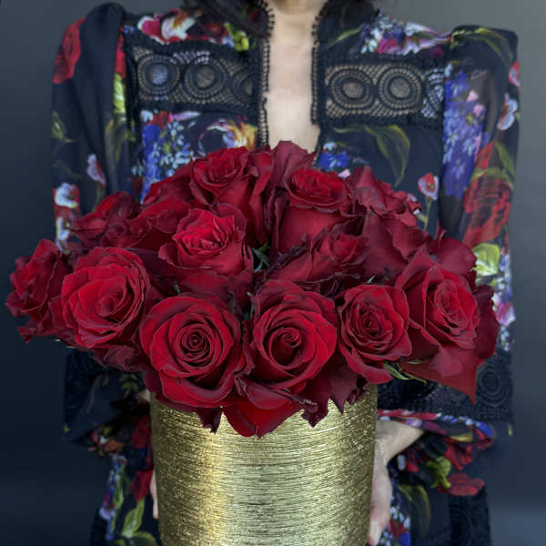 Low and Lush. 35 roses in stunning vessel.