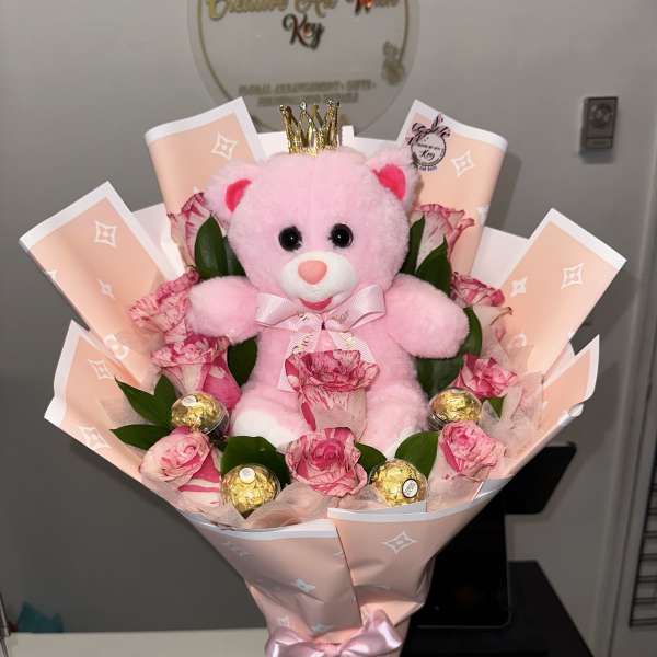 Two-tone roses in one, pink teddy bear, Ferrero Rocher chocolates encapsulated in acrylic, pink LV paper