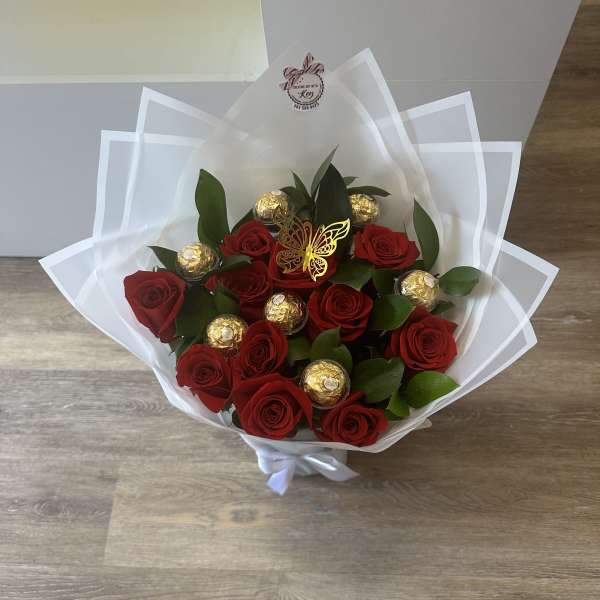 Beautiful red roses, Ferrero Rocher chocolates encapsulated in acrylic