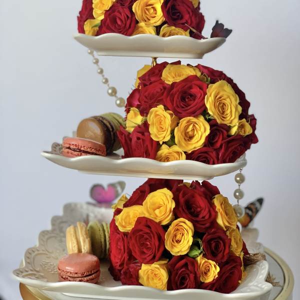 3 level desert holder with three flower balls and French macaroons