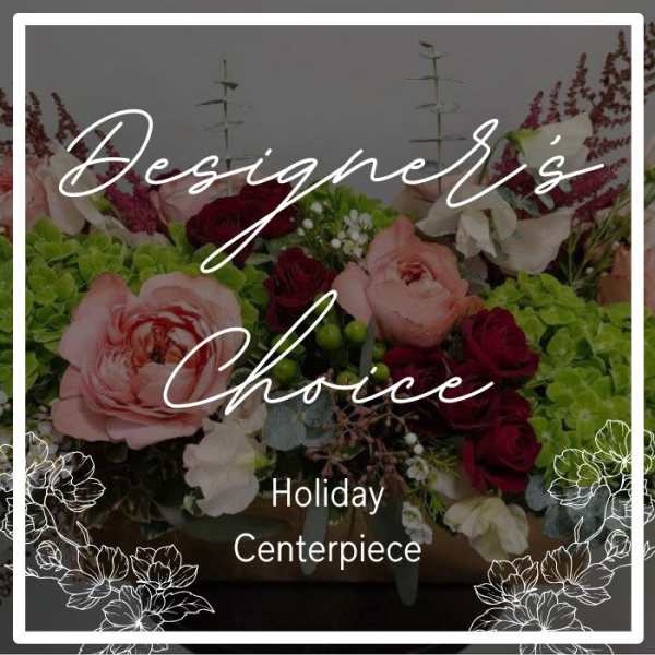 Low holiday centerpiece with pink and red roses and green hydrangeas in a rectangular wooden container