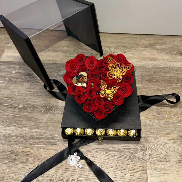 box with natural roses, 48 ​​Ferrero Rocher chocolates in the bottom drawer, decorative butterfly, and acrylic Valentine's Day topper.
