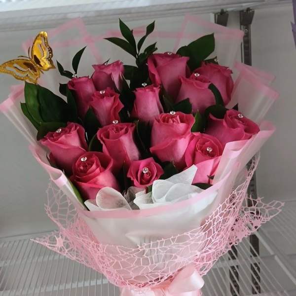 beautiful fuchsia roses, butterfly ornament