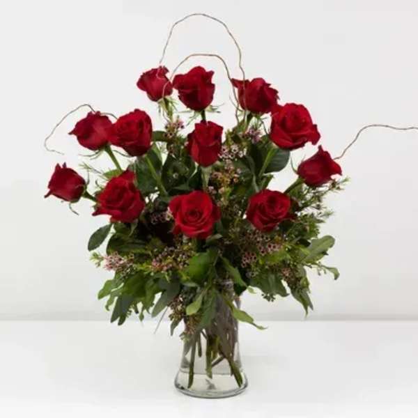 12 red roses in a vase