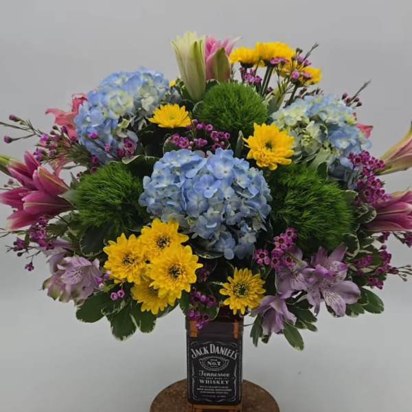 All for One (Wine / Jack or anything of your choice +Flowers + Chocolates)