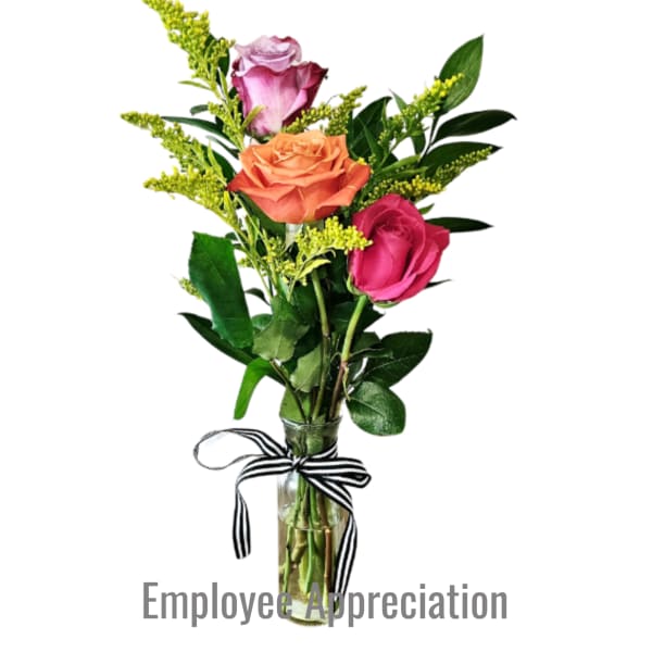 Small bud vase with pink, orange, and lavender roses with yellow filler and a striped ribbon.