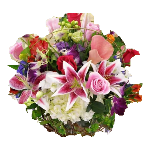 Mixed bouquet with pink lilies, roses, and purple flowers arranged in a basket