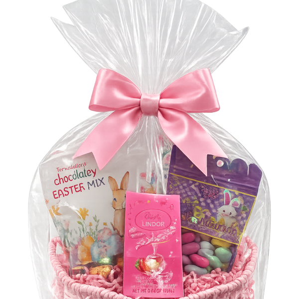 Easter candy gift basket wrapped in clear cellophane with a pink bow and assorted pastel sweets in a pink woven basket