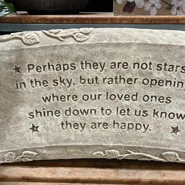 Rectangular stone memorial plaque with engraved sympathy quote and small star accents.