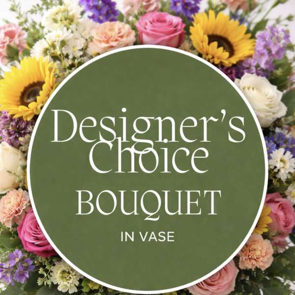 Mixed bouquet of sunflowers, roses, and other blooms in a clear vase with a text overlay.
