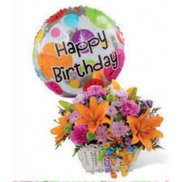 Basket of orange lilies and mixed pink and purple flowers with a Happy Birthday balloon.