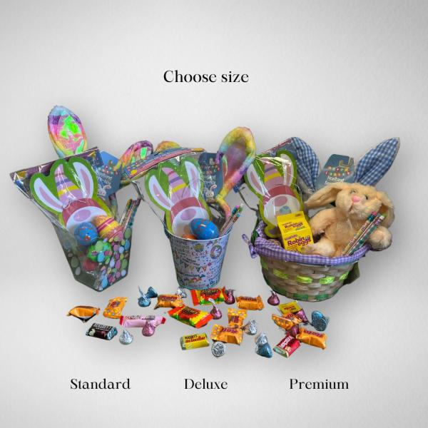 Three Easter gift baskets in different sizes filled with bunny ears, toys, and assorted candy.