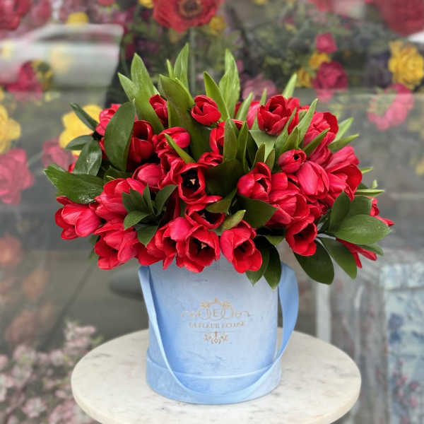 Box with red tulips