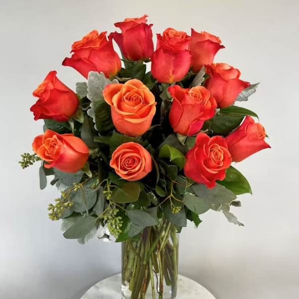 One dozen orange roses