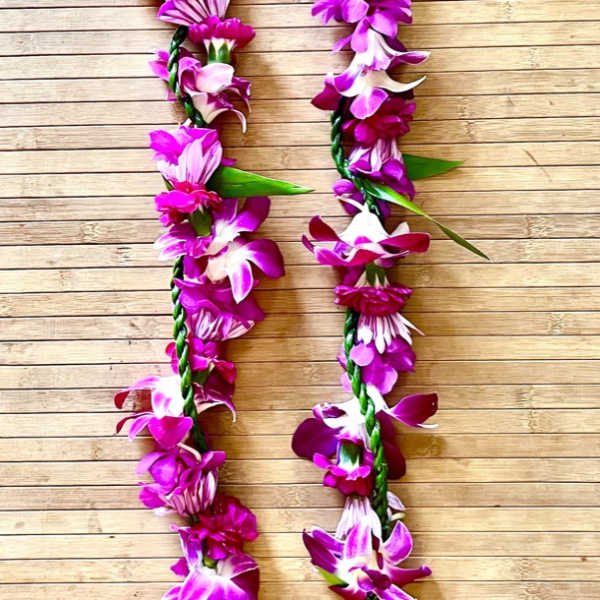 Kui purple flower lei with ti leaf lei wrap