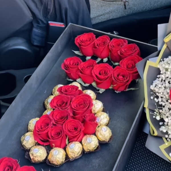 Black gift box with red roses and Ferrero Rocher chocolates
