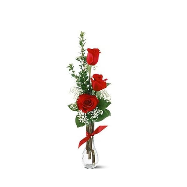 Tall red rose arrangement in a clear glass vase with a red ribbon