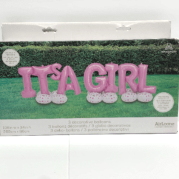 Boxed set of pink 'It's a Girl' letter balloons with white polka-dot bases on a grassy background