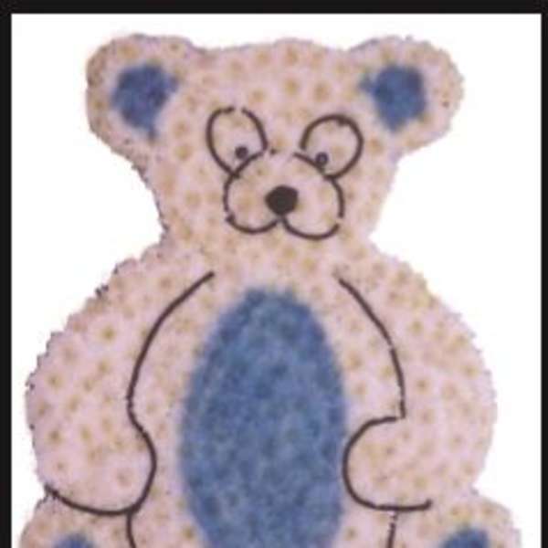 Teddy bear-shaped floral tribute with blue and pale pink flowers