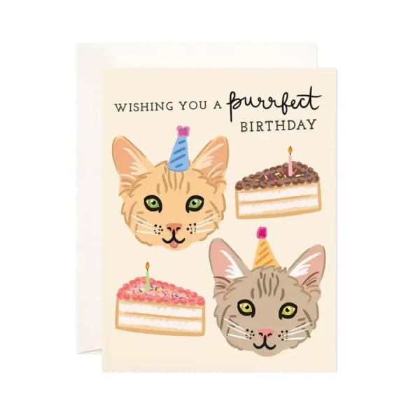 Birthday card with two cats wearing party hats and cake illustrations