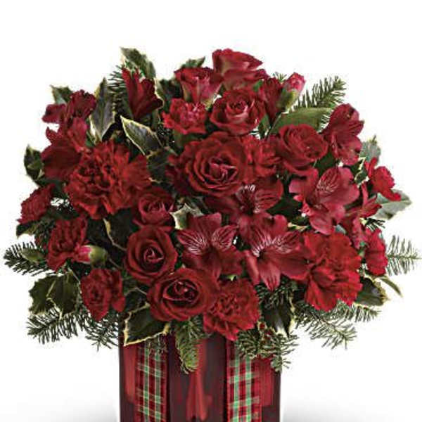 Red roses and carnations in a plaid gift box