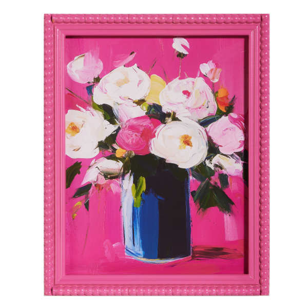 Framed abstract painting of white and pink flowers in a blue vase on a bright pink background