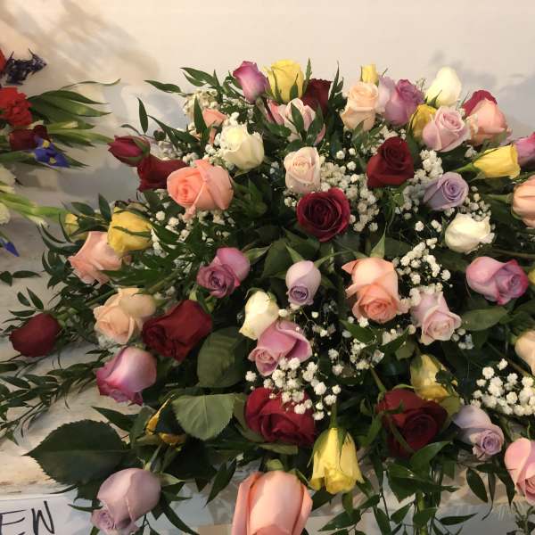 Large bouquet of multicolored roses with baby's breath