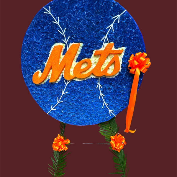 Mets-themed floral tribute with a blue circular sign and orange ribbon accents
