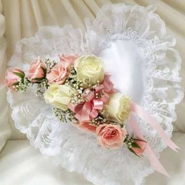 White lace bouquet with pink and cream roses and ribbon