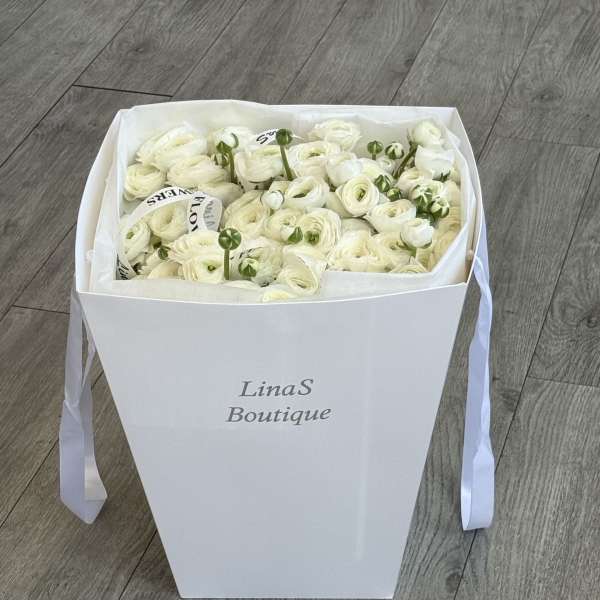 White ranunculus bouquet in a white gift box