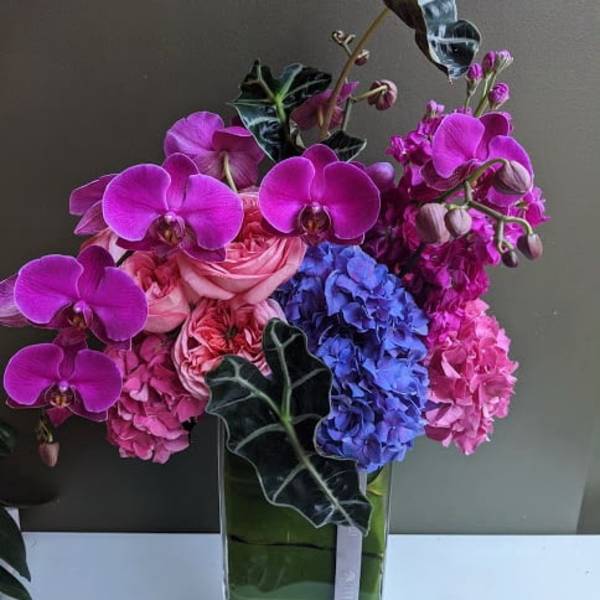 Raspberry Slim and Sexy Design with roses orchids and hydrangea