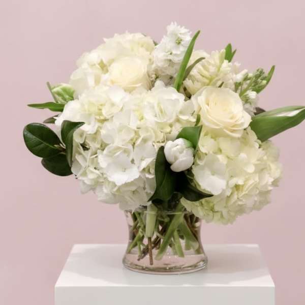 White floral bouquet in a clear glass vase