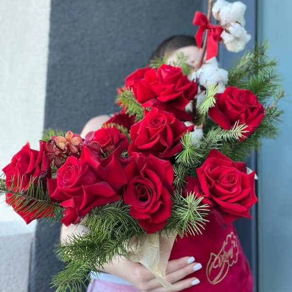 Bouquet of red roses with pine and cotton accents
