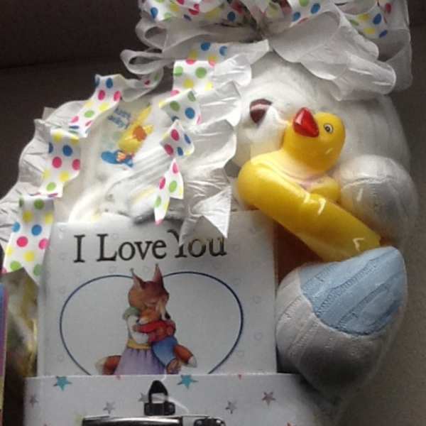 Gift basket with a teddy bear, duck toy, and greeting card