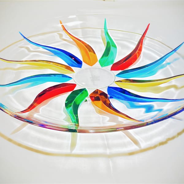 Colorful glass bowl with a rainbow swirl pattern