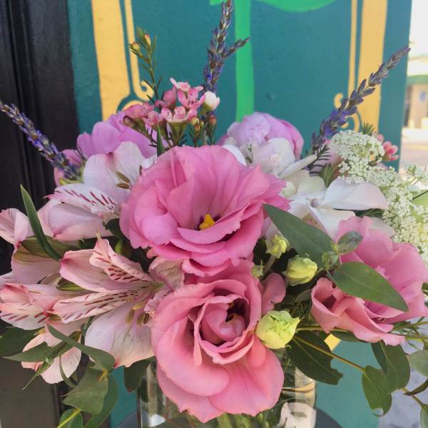 Pink and white bouquet in a clear glass vase