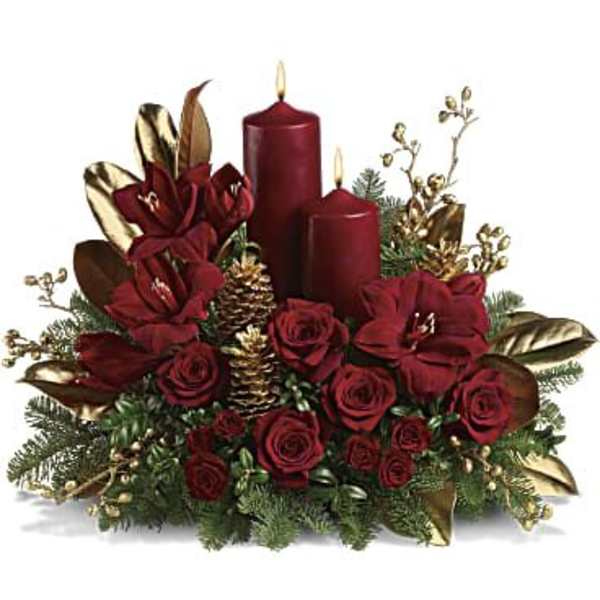 Red roses with candles and pinecones in a holiday centerpiece