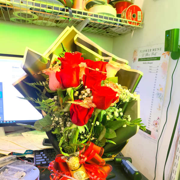 PINK AND RED ROSES WITH BLACK WRAPPING AND GOLD BUTTERFLIES