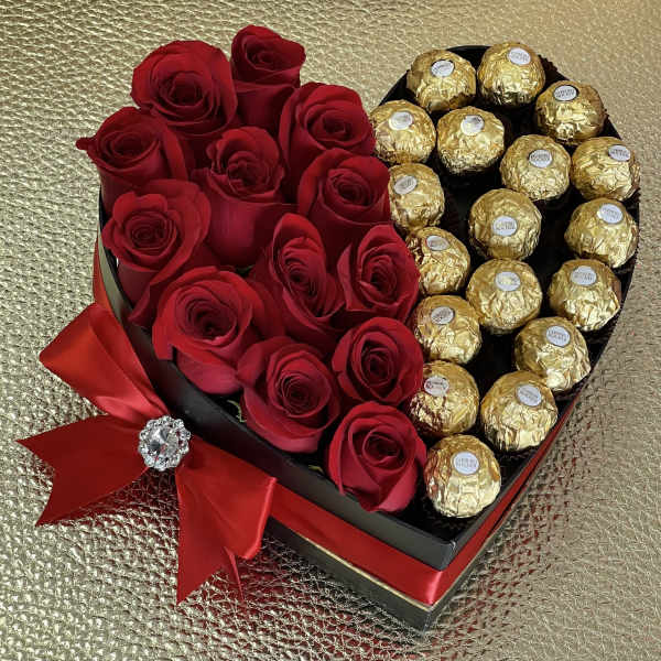 Heart-shaped box with red roses on one side and gold-wrapped chocolates on the other