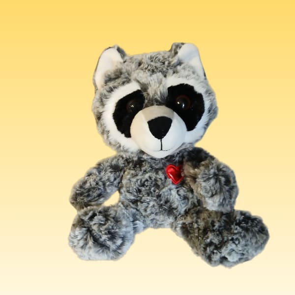 Plush raccoon with a small red heart on its chest