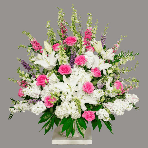 Pink roses and white lilies in a glass vase