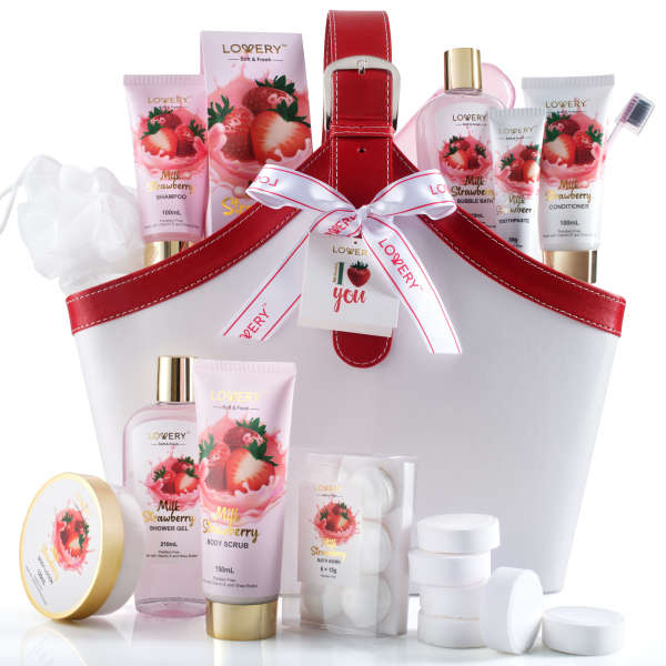 Strawberry bath and body gift set in a white and red tote with assorted bottles and bath tablets