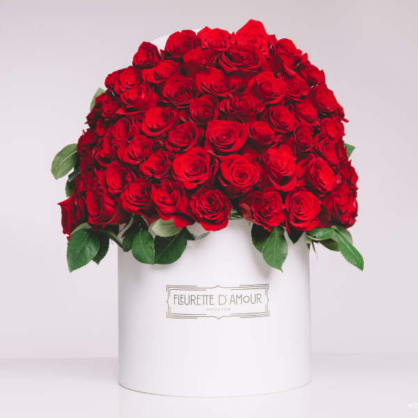 Large dome of red roses in a white hatbox