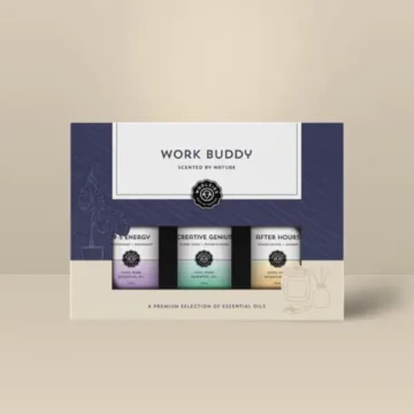 Boxed Work Buddy essential oils gift set with three small bottles in a navy and beige package
