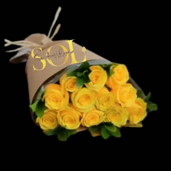 Bouquet of yellow roses wrapped in beige paper
