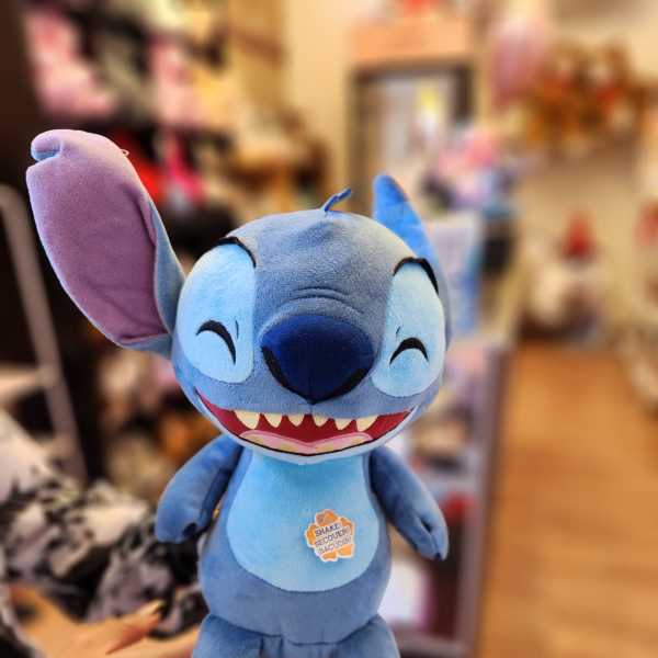 Blue Stitch plush toy with a smiling face and large ears