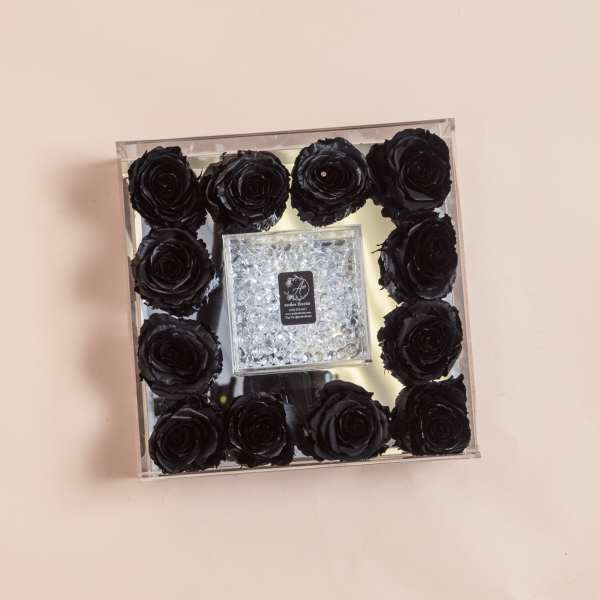 Square box of black roses with a clear jeweled center